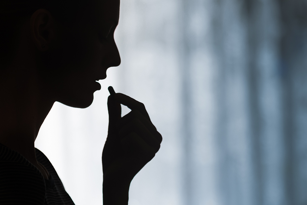 Woman Drinking Medicine